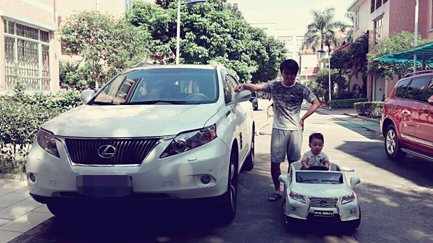 Chinese father and son with car