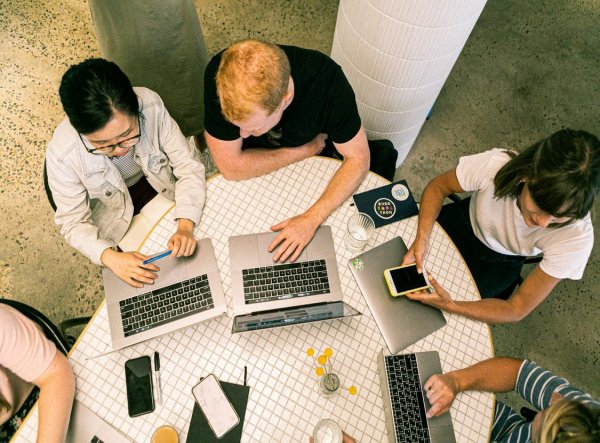 People working on digital marketing strategy on laptops