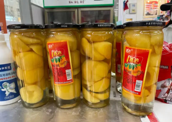 Canned yellow peaches in the supermarket